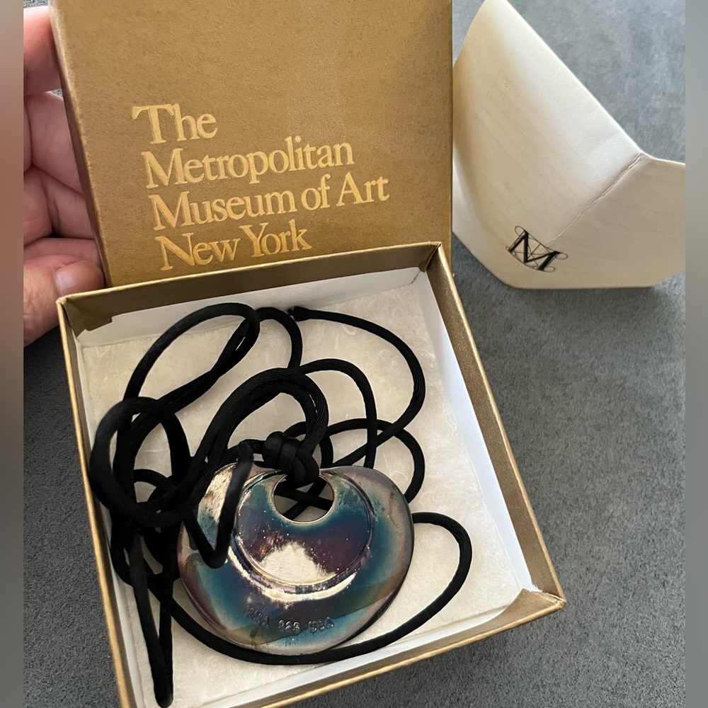 The Met Colombian ornament pendant on black silk choker in Box needs good polish